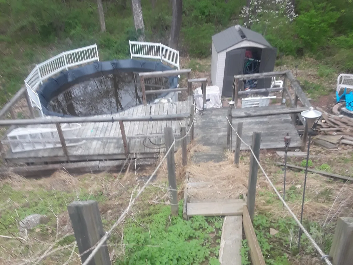Above-ground pool, deck and back-yard shed before removal